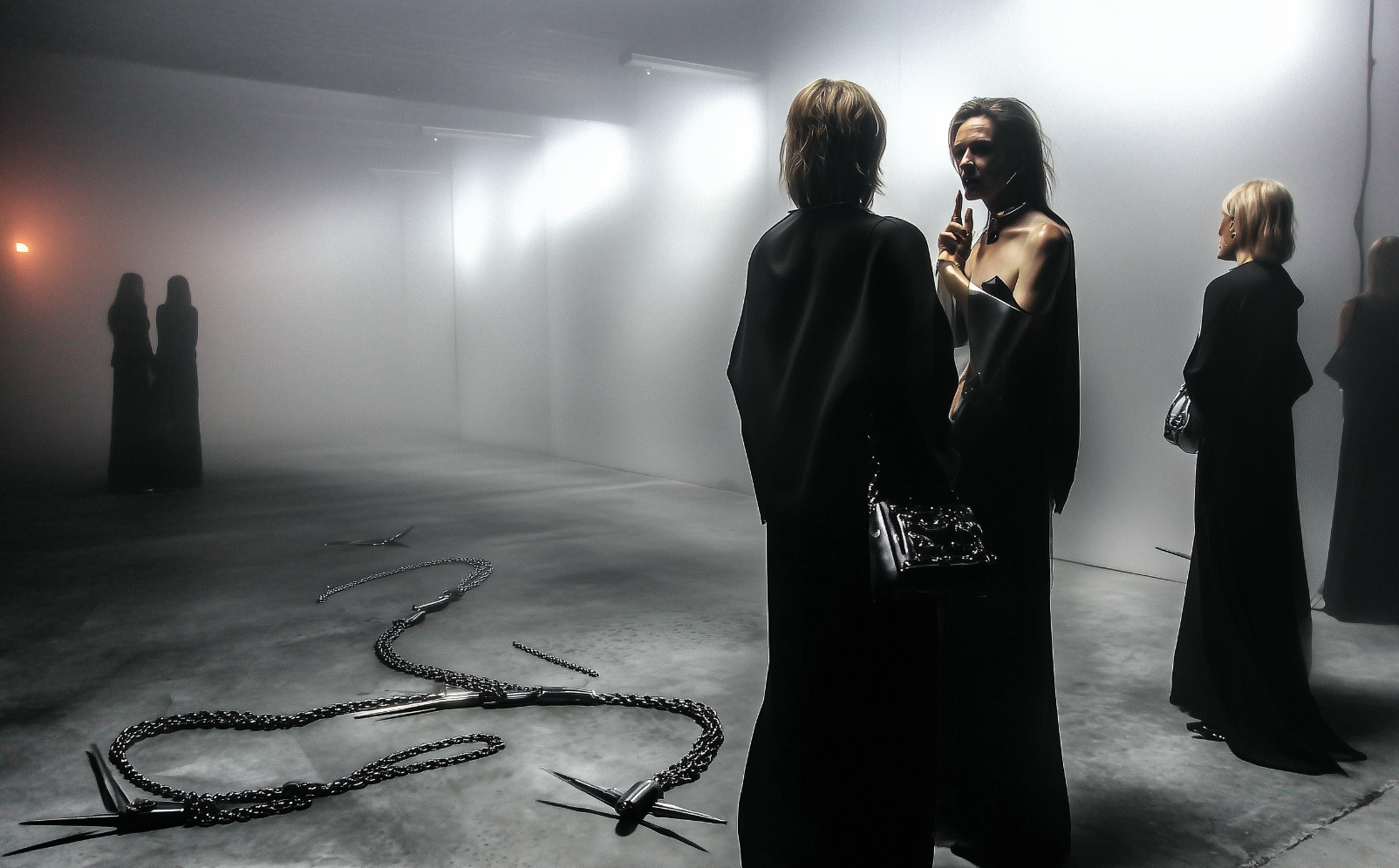 Two figures in a foggy gallery
